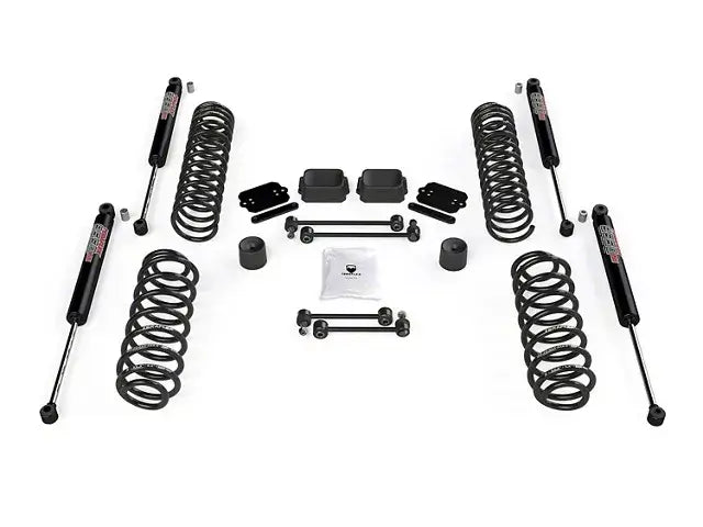 2.5in Coil Spring Base Lift Kit with 9550 VSS Twin-Tube Shocks for JL 4Dr, featuring all essential parts for larger tires and enhanced off-road capability
