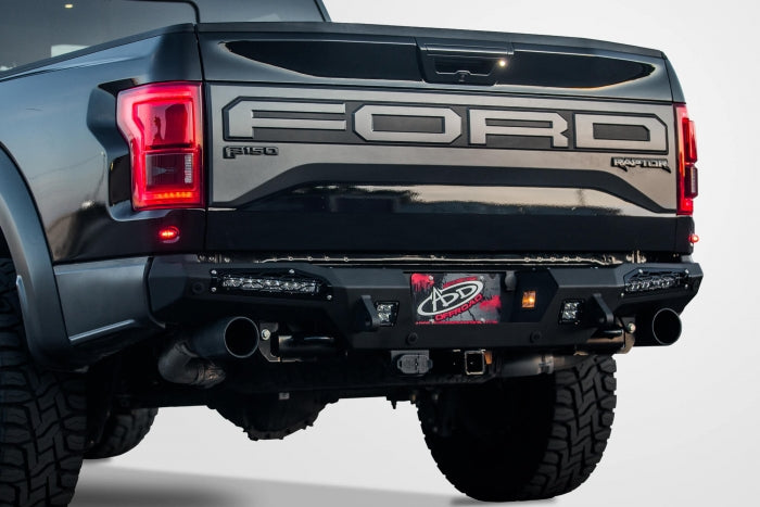 2017 Ford Raptor HoneyBadger Rear Bumper with  Tow Hooks and BACKUP SENSORS with 10 SR LED light bar mounts and Dually mounts in Hammer Black with Satin Black panels.