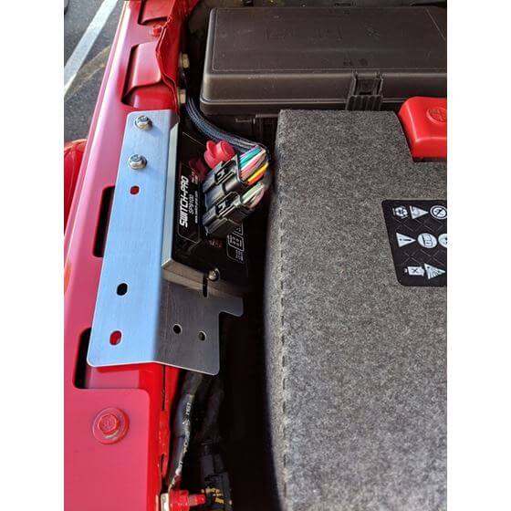 Switch-Pros Mounting Kit installed in Jeep JL under driver's grab handle with wiring included for easy access and integration.
