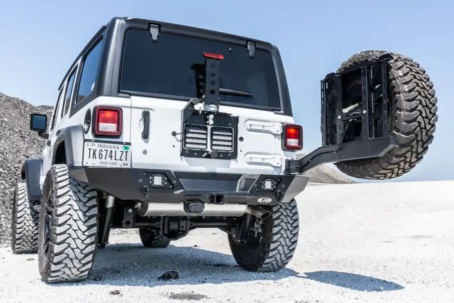 Jeep JL with LOD Destroyer full width rear bumper and tire carrier displayed in rugged outdoor setting