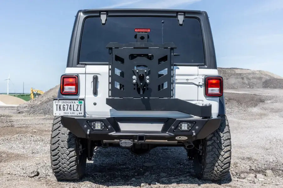 Jeep Wrangler with LOD Destroyer Shorty Rear Bumper and Tire Carrier on a rugged trail
